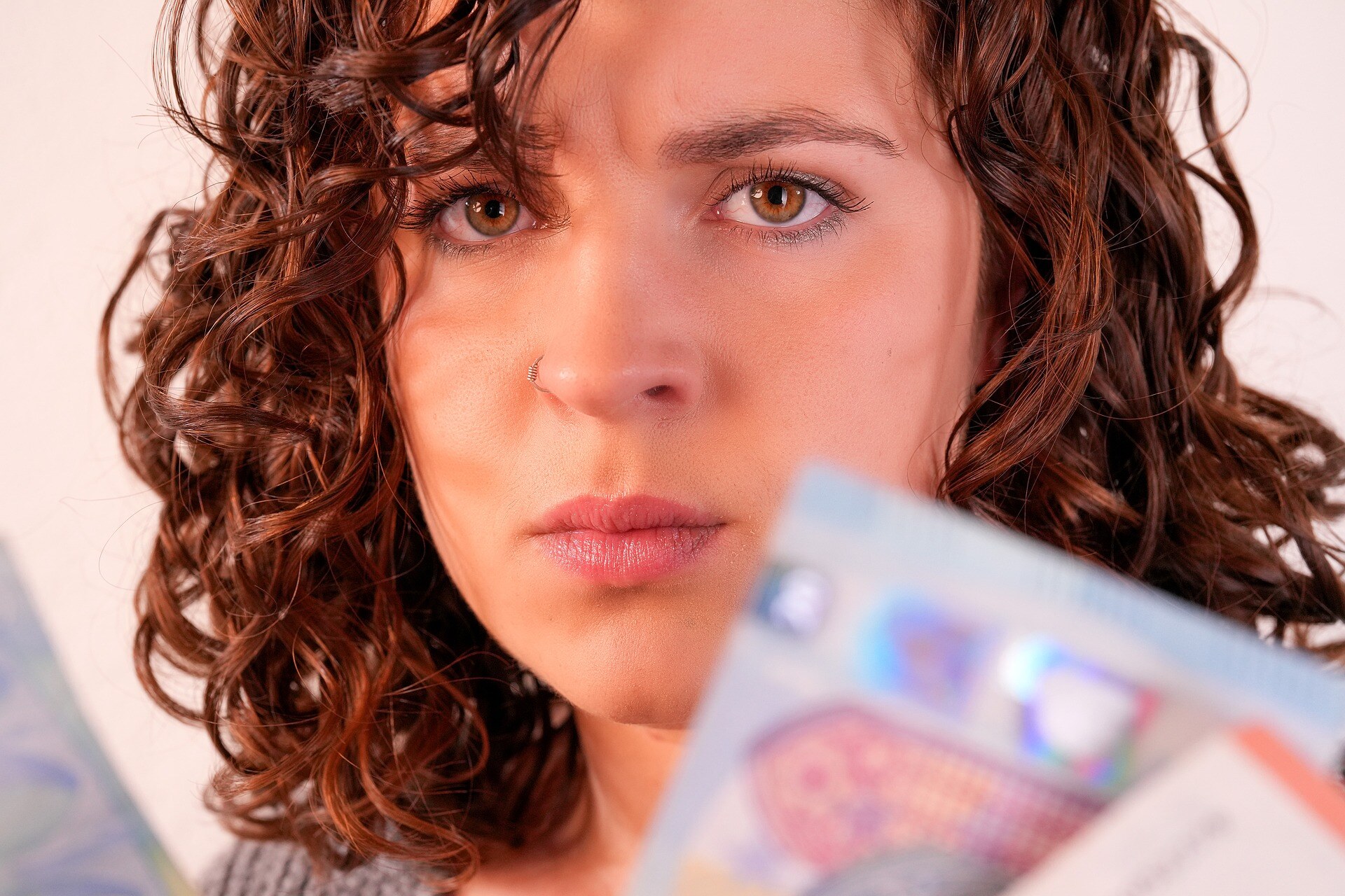 frustrated woman with money
